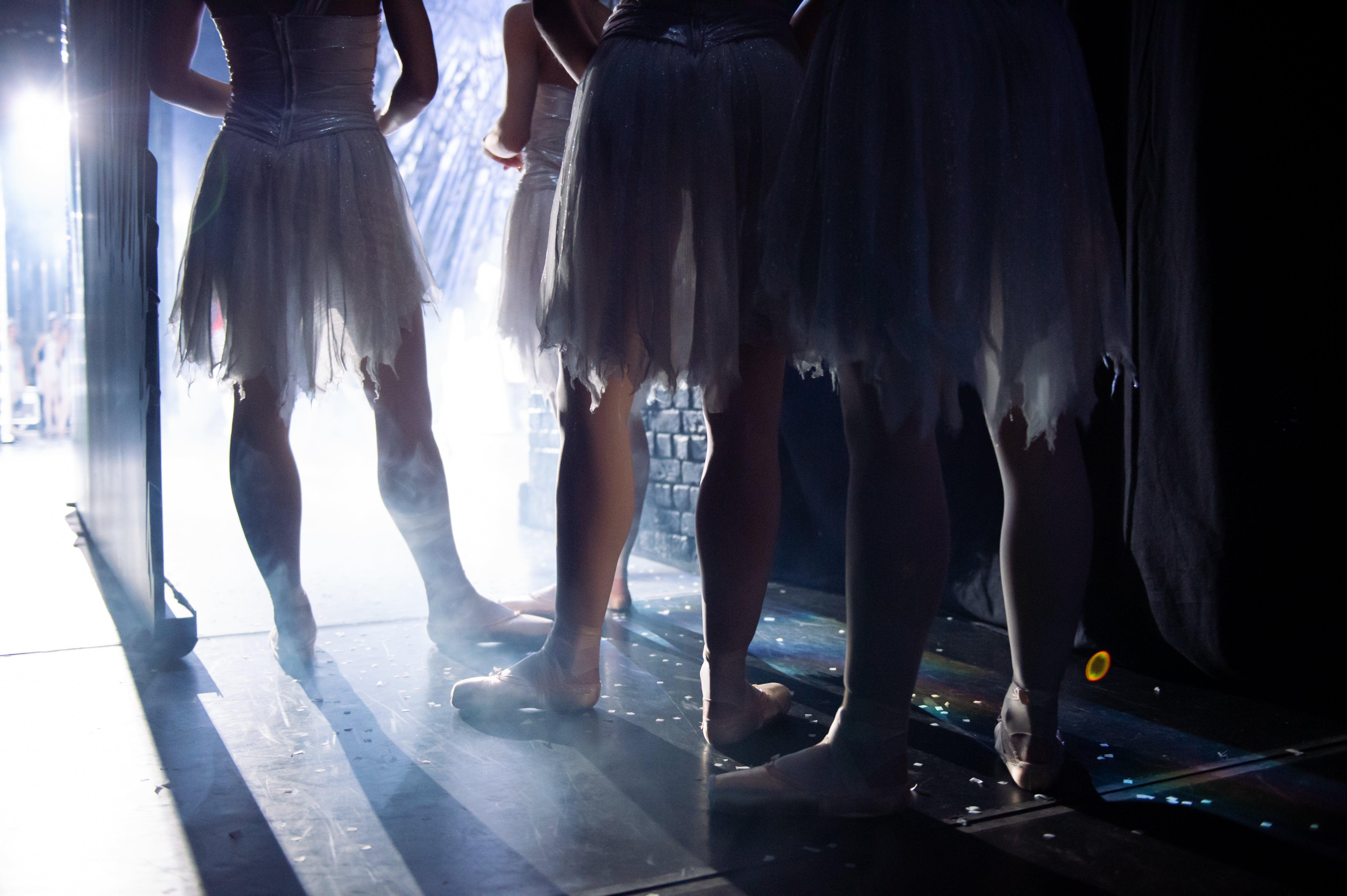 scottish ballet dancers shown side stage in their snow queen costumes wearing pink ballet tights by imperfect pointes