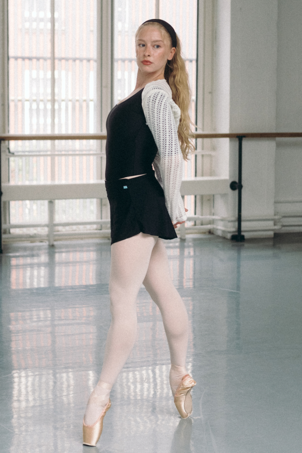 dancer wearing a black ballet skirt in the studio