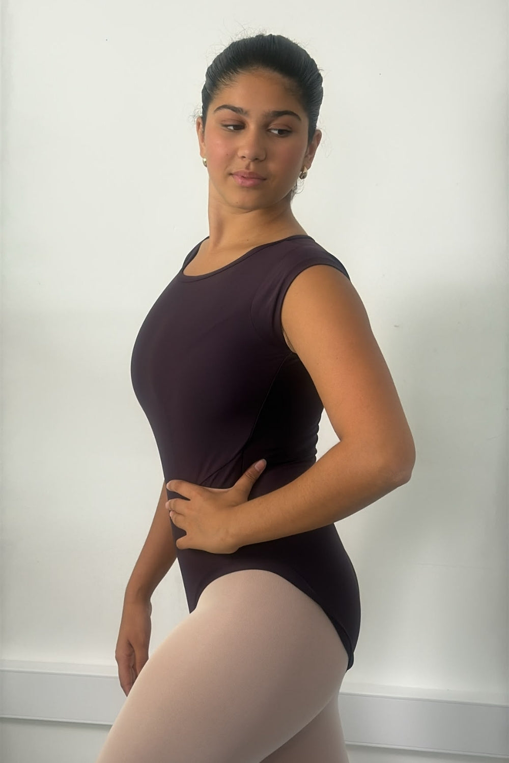 We Got Boobs cap sleeve dance leotard in Cherry Noir — front view, worn by a dancer at the barre