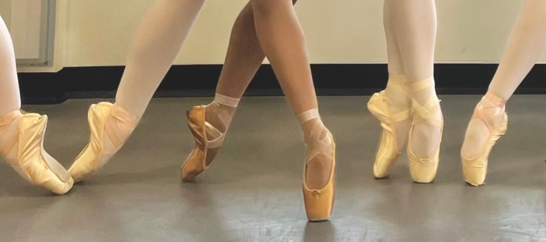 ballet dancers from Tights Under wearing imperfect pointes bronze and pink ballet tights with their pointe shoes