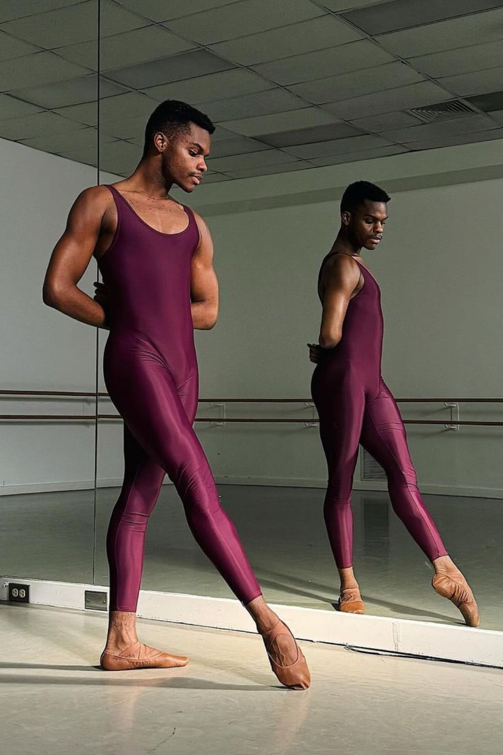 Dani Durrett black male ballet dancer Boston Ballet wearing plum coloured ballet unitard 