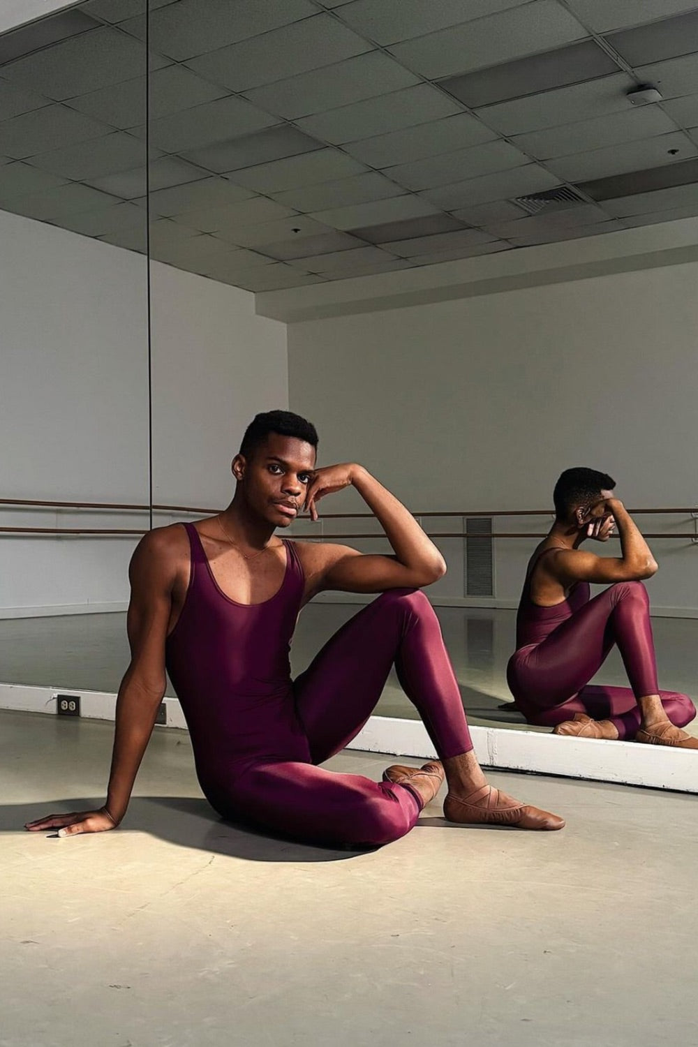 Dani Durrett black male ballet dancer Boston Ballet wearing plum coloured ballet unitard 