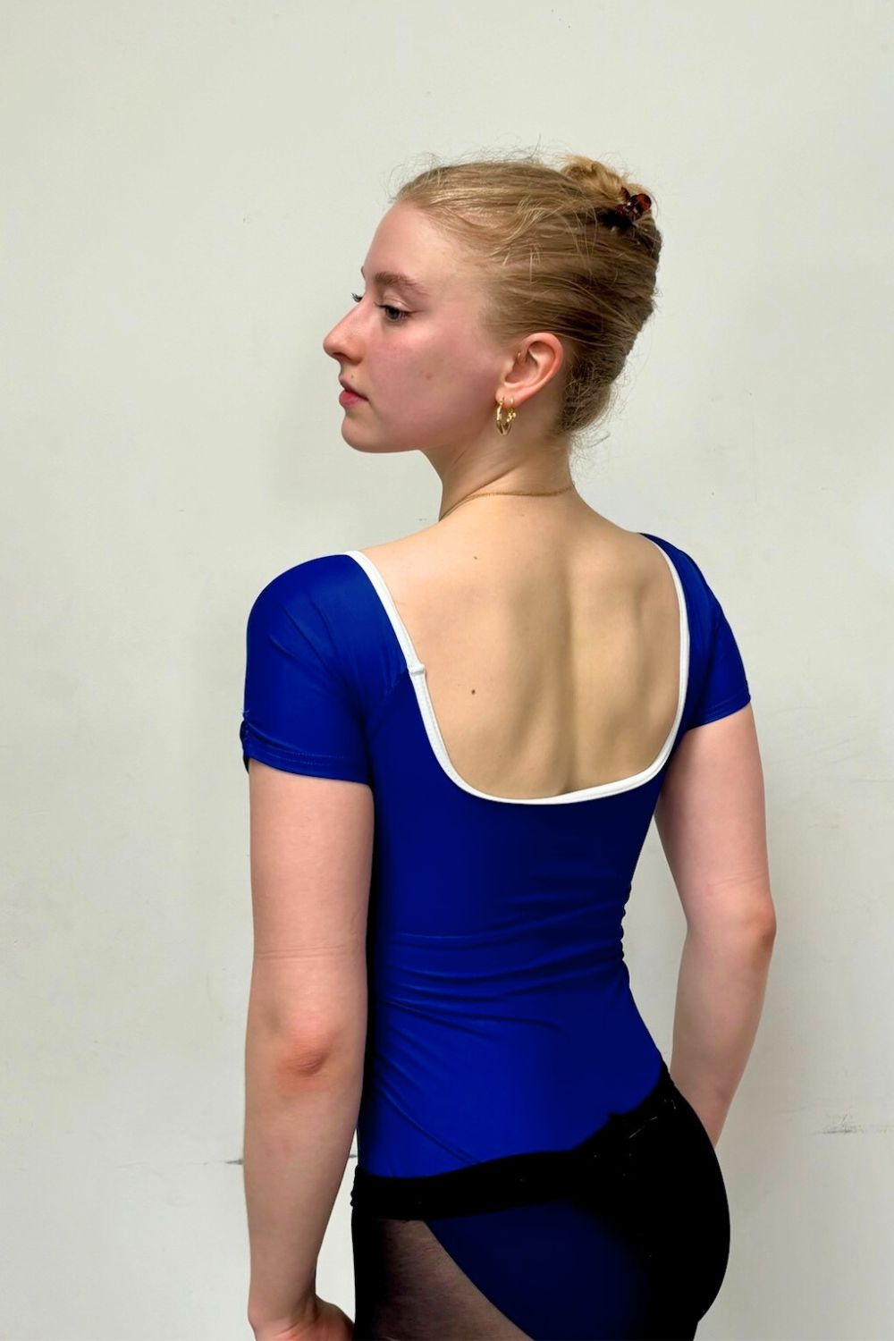 ballerina wearing imperfect pointes sustainable alexandria leotard in racing blue 