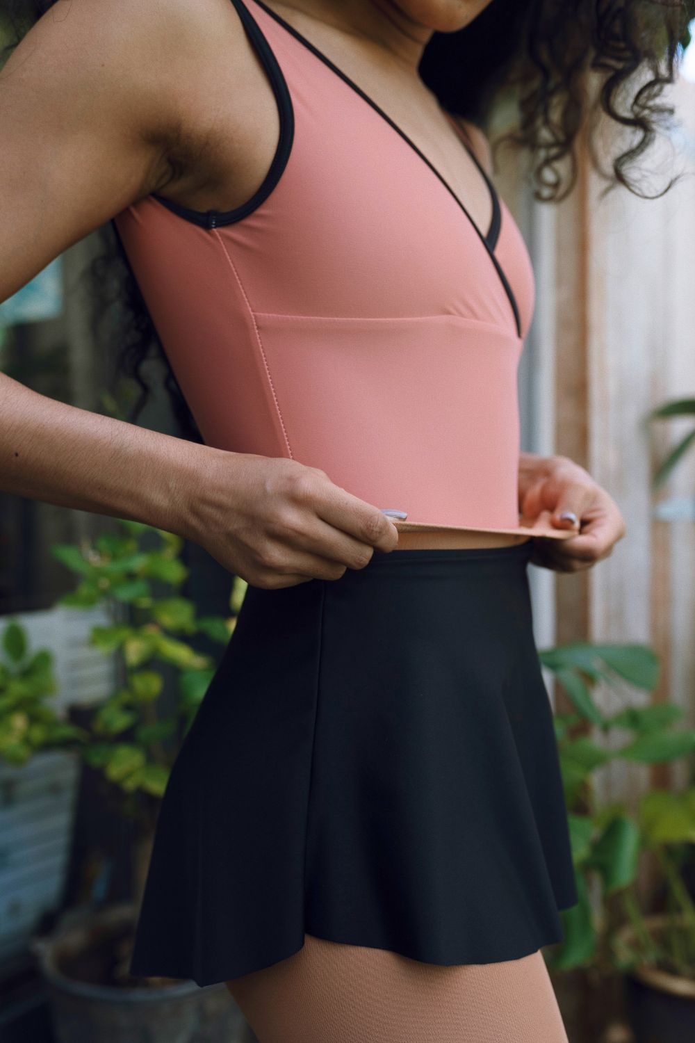 Women's Marseille Wrap Front Ballet Leotard – Porcelain Peachy with black trimim - New, Sleeveless - Imperfect Pointes with matching black skirt worning by Mikayla Isaacs Ballet Black 