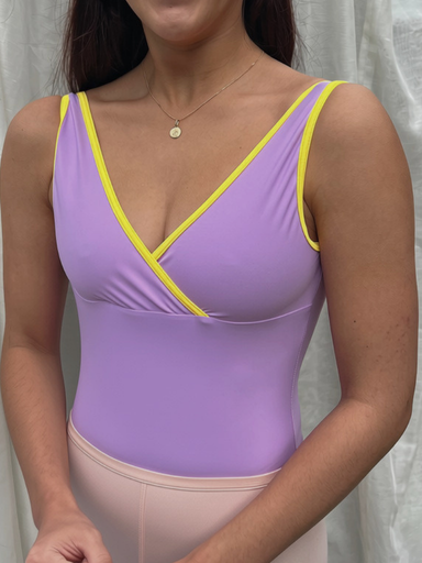 dancer wearing a lilac leotard and pink tights